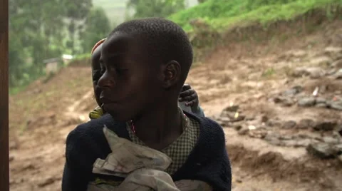 African Boy from Batwa Tribe Taking Care of His Little Brother, Uganda Stock Footage 40926241