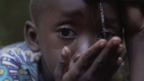 African Boy Drinking Stock Footage 97063467