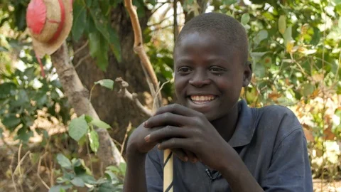 An African Boy Looking at the Camera co Stock Footage 115731024