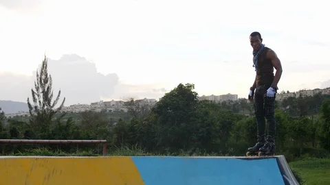 African boy rollerblading on the ramp 4K clip Stock Footage 113108227