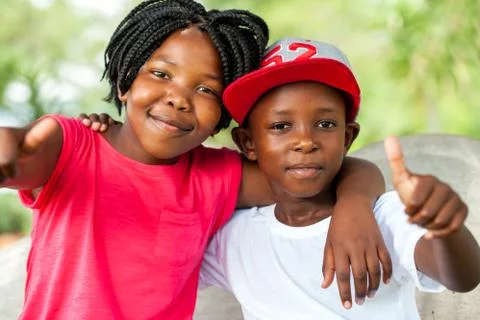 African brother and sister doing thumbs up. Stock Photos