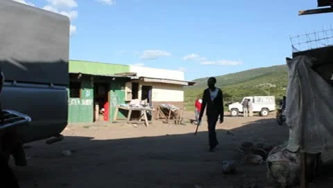 African Bus Pulls in to Town Stock Footage 10573497