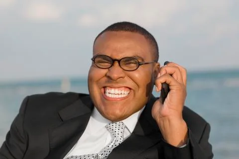 African businessman talking on cell phone Stock Photos