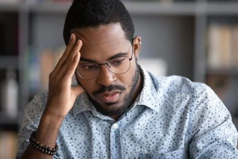 African businessman thinking of problem solution feels concerned Stock Photos