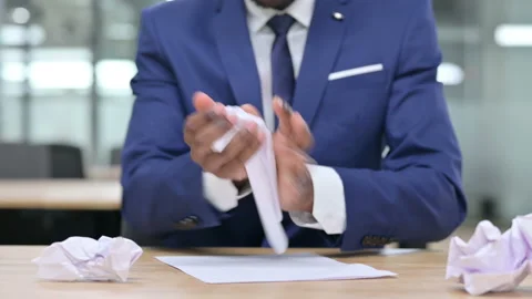 African Businessman Trying to Write, Torn Paper Stock-Footage 138491589