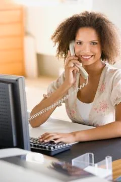 African businesswoman talking on telephone Stock Photos
