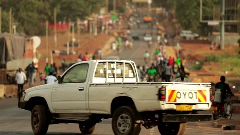 African busy Crowd of people walking and driving in main street marketplace Stock Footage 88017341