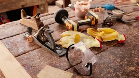 African carpenter's workshop with a rustic workbench and traditional tools Stock Footage 346734020