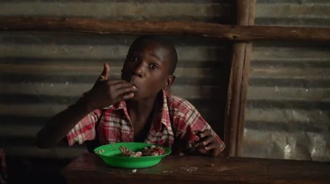 African Child Eating, Uganda Stock Footage 40928748
