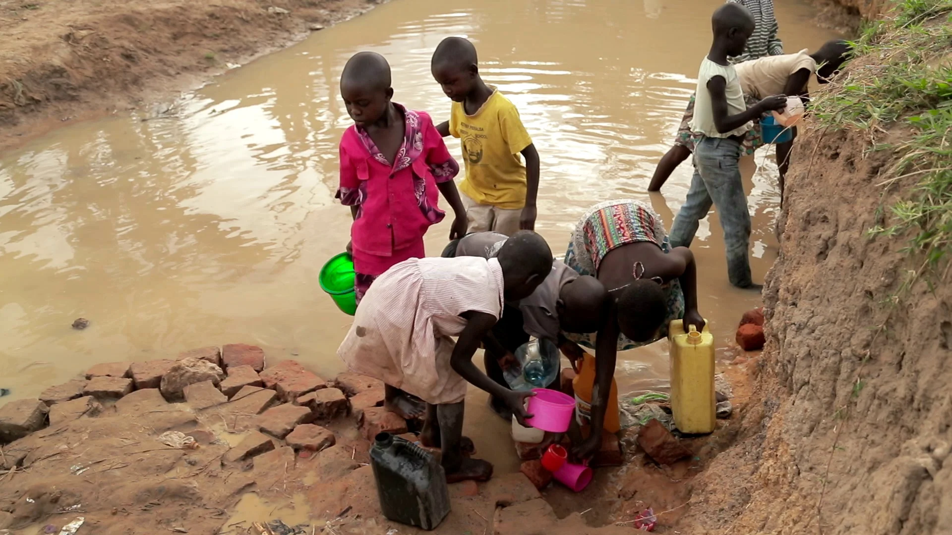 kids drinking dirty water