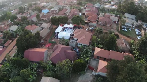 African community hosting the wedding function in white tents 스톡 동영상 157702521