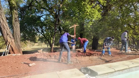 African Construction Site, Swimming Pool Build Slow Motion Panning Left to Right Vídeo Stock 337735773