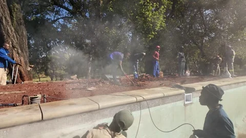 African Construction Site, Swimming Pool Build Slow Motion Rising Crane Shot Vídeo Stock 337735787