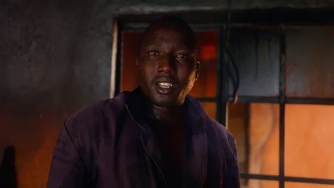 African cook looking into camera Stock Footage 79646878