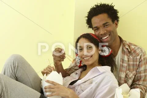 African couple eating take-out Stock Photos