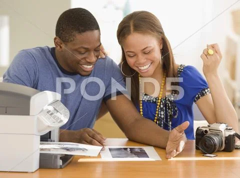 African Couple Printing Out Photographs