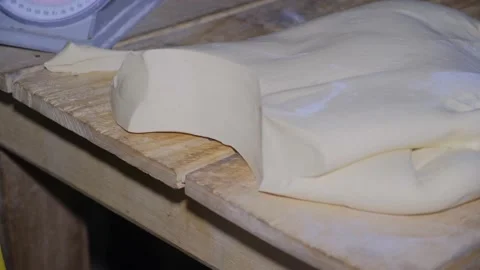 African cutting bread dough closeup 動画素材 157433553