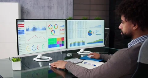 African Data Analyst Man Using Spreadsheet Stock Footage 226179061