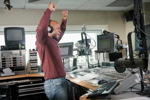 African dj working at radio station Stock Photos