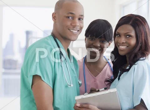 African doctor and nurses in hospital Stock Photos