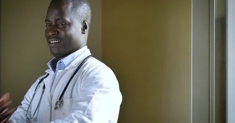African doctor smiles. concept of medicine in the world Stock Footage