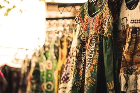 African dress hanging in African street fashion market Stock Photos