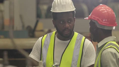 African engineer foreman training talk job process explain to new staff worke Stock Footage 172571208