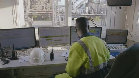 African engineer leaving control room Stock Footage 114349051