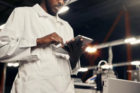 African engineer working with tablet at factory Foto stock