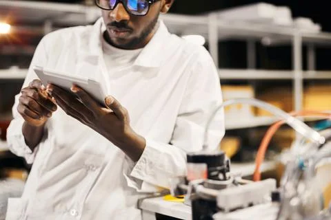 African engineer working with tablet at factory Foto stock