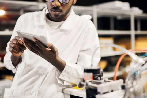 African engineer working with tablet at factory Stock-Fotos