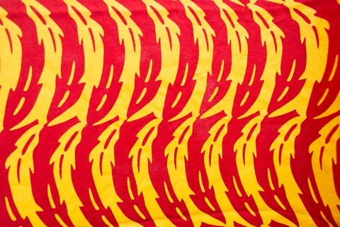 African fabric pattern in red and yellow Stock Photos