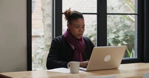 African female college student typing on laptop Stock Footage