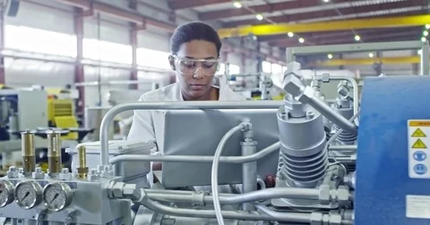 African Female Factory Engineer Using Laptop Stock Footage 77796312