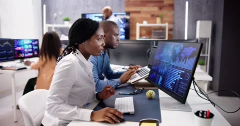 African Financial Data Analysts Using Dashboard On Screens Stock Footage 248110336