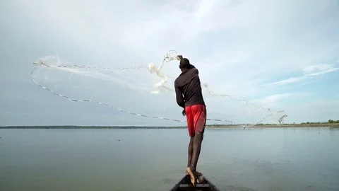 Man casting Fishing line into Lake Inari, Stock Video