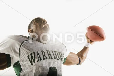 African football player holding football and celebrating Stock Photos