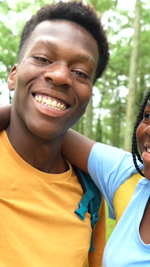 African friends gesturing success taking selfie together in the forest Stock Footage 282508519