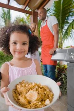 African girl holding bowl of cereal Stock Photos