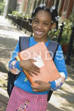 African Girl Holding School Books