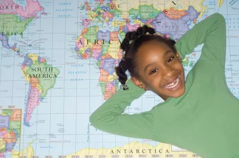 African girl laying on world map Stock Photos