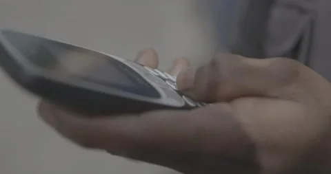 African Hand using old Nokia Phone Stock Footage 157206978