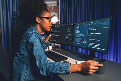 African IT developer concentrating codding program on laptop screen. Tastemaker. 스톡 사진