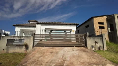 African Luxury Housing Developments with Car Wash, Medium Driving Shot 1 Stock-Footage 337294732