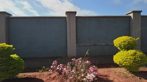 African Luxury Housing Developments Security Wall, Medium Driving Shot Stock-Footage 337294940