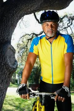 African male cyclist next to bicycle Stock Photos