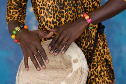 African male hands playing on jembe drum, closeup Stock Photos