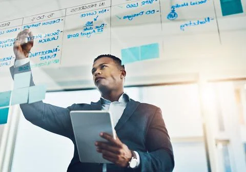 African, man and tablet with notes on glass for planning schedule, daily task Stock Photos