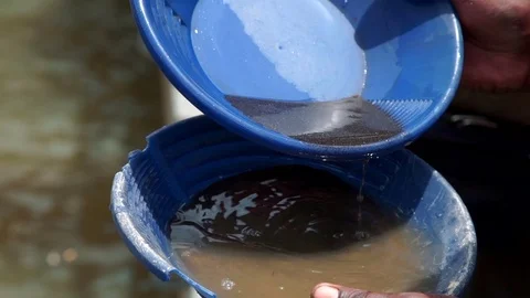 African man are working to sift the sand for gold mining. Detail Stock Footage 71178878
