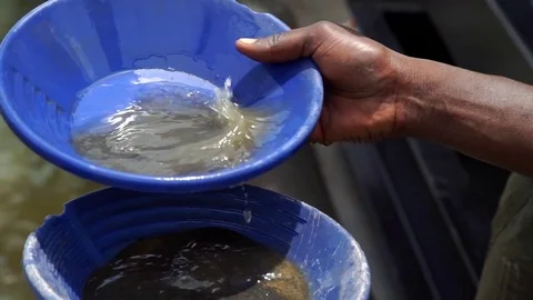 African man are working to sift the sand by gold, mining. Detail Stock Footage 71191934